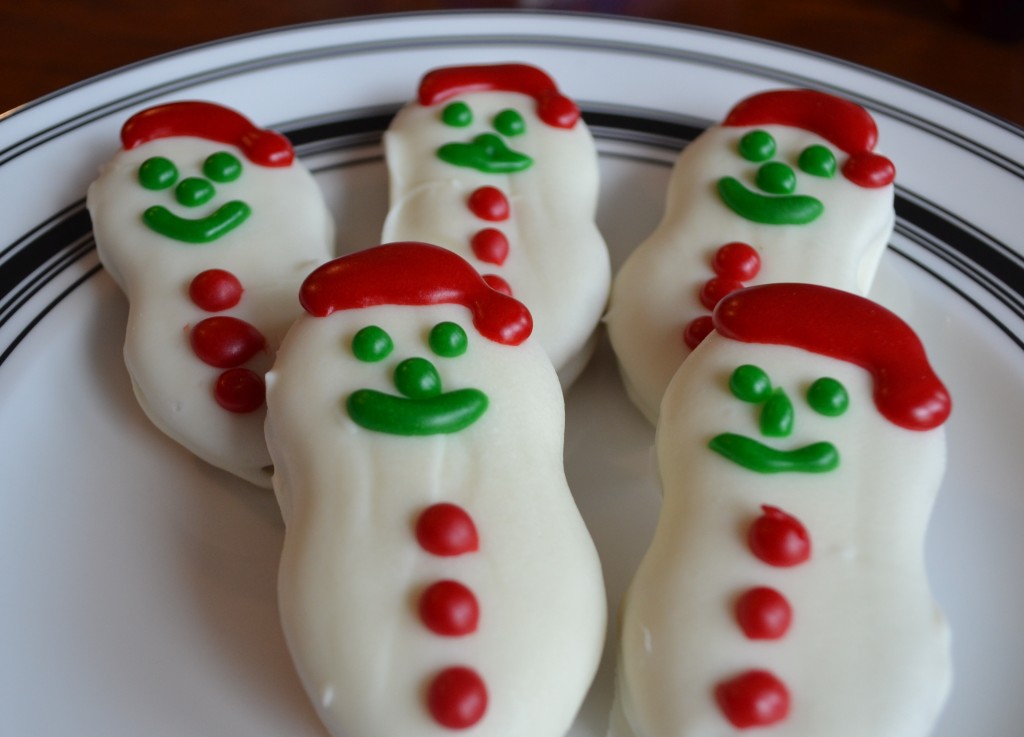 Nutter Butters+ White Candy Coating+Cookie Icing=Santa Snowman