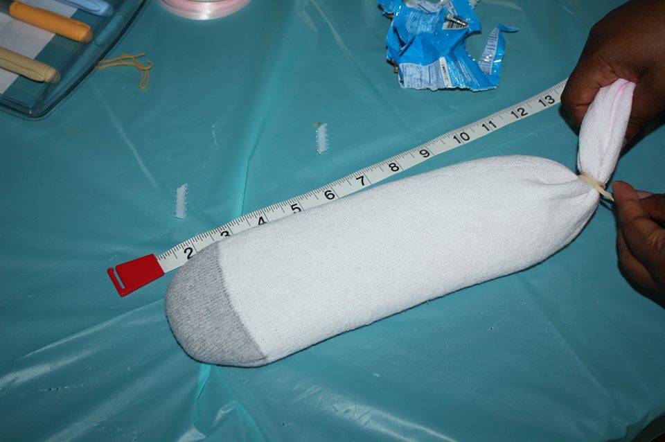 We made sock babies, filled with rice to weigh the exact weight of our preemie's birth and measured to the exact length.