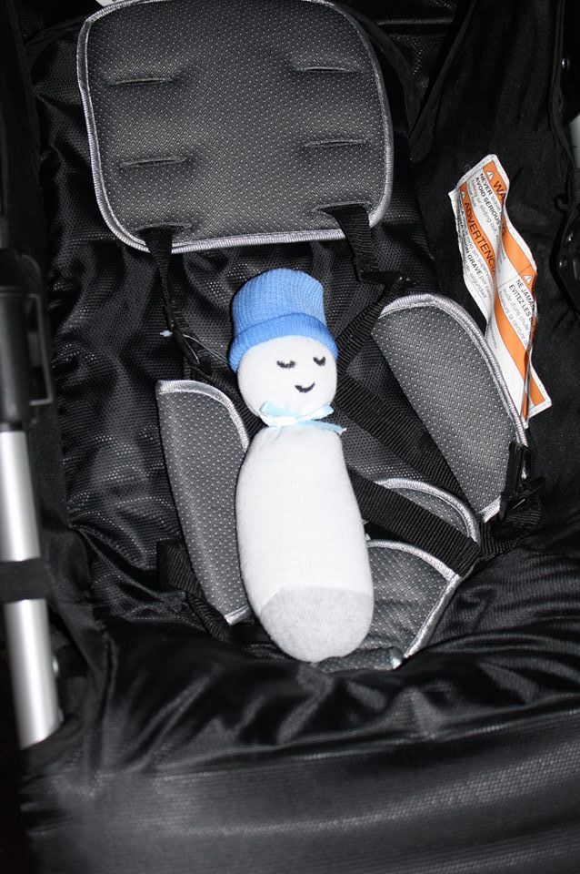 Micropreemie sock baby in full size car seat. 