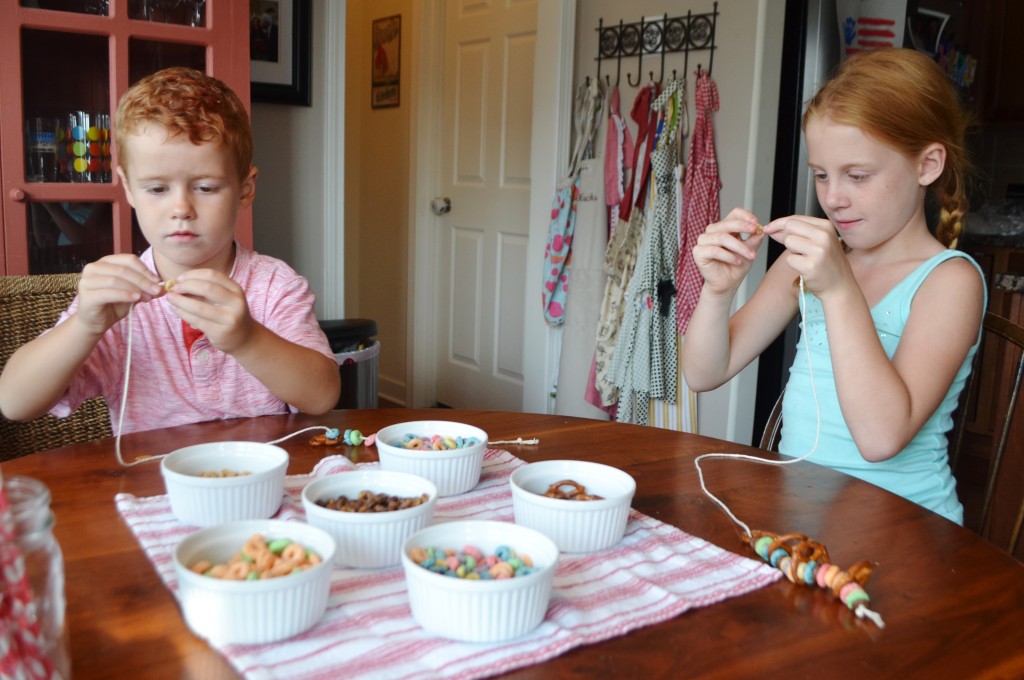 The niece and nephew came over for a Cousin Night before school started back. We made these fun snack necklaces to eat while we watched a movie. 